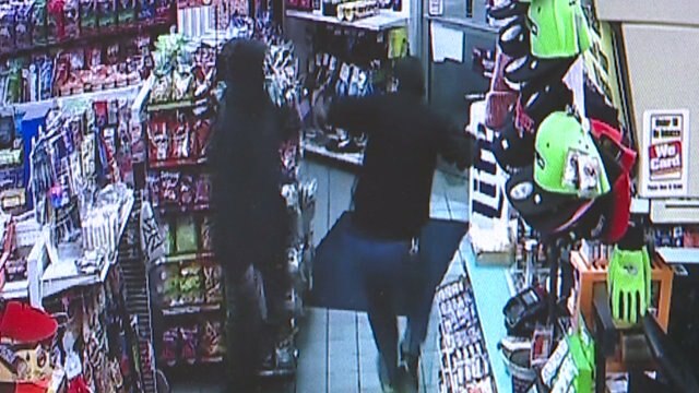 RAW: Video shows customer save clerk from being shot