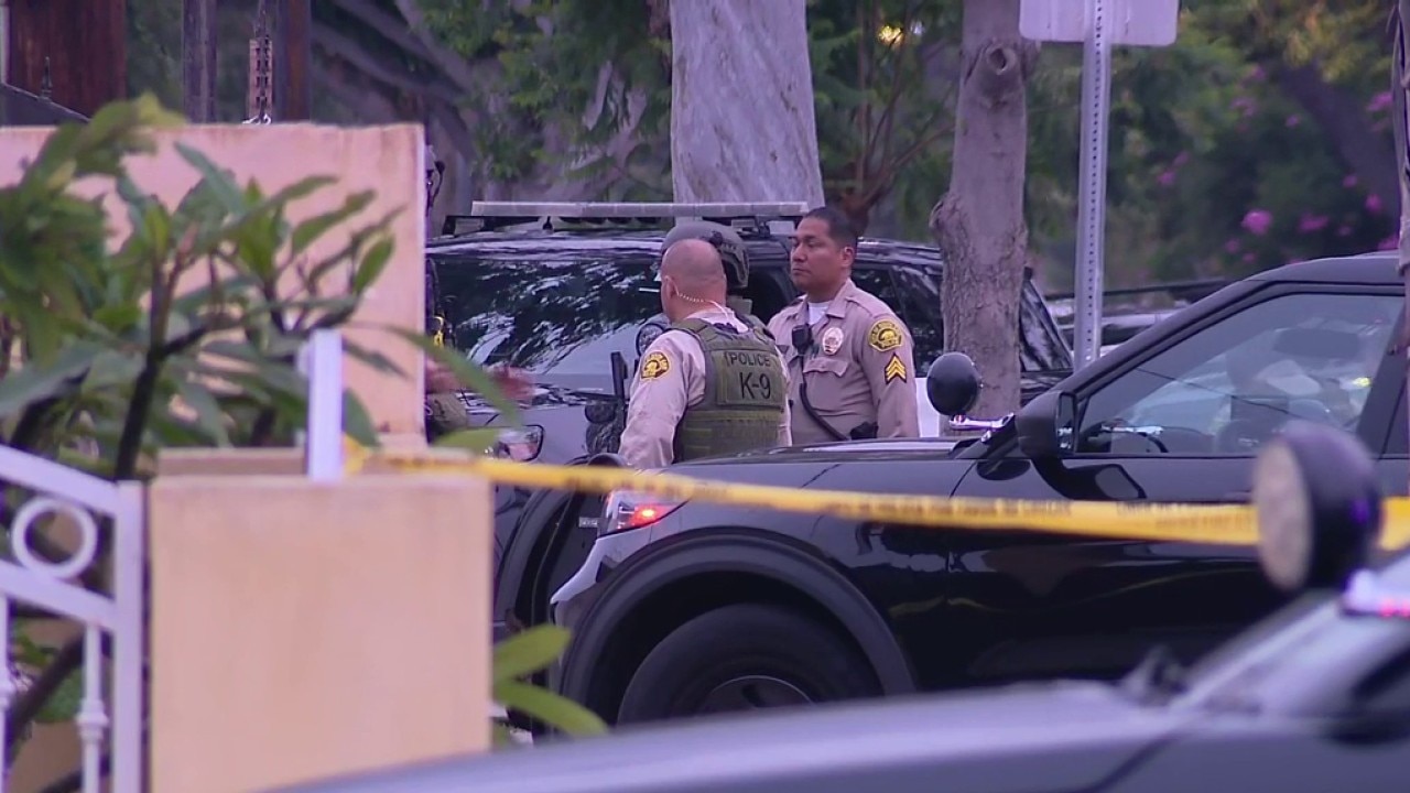 Armed man barricaded in South Gate garage
