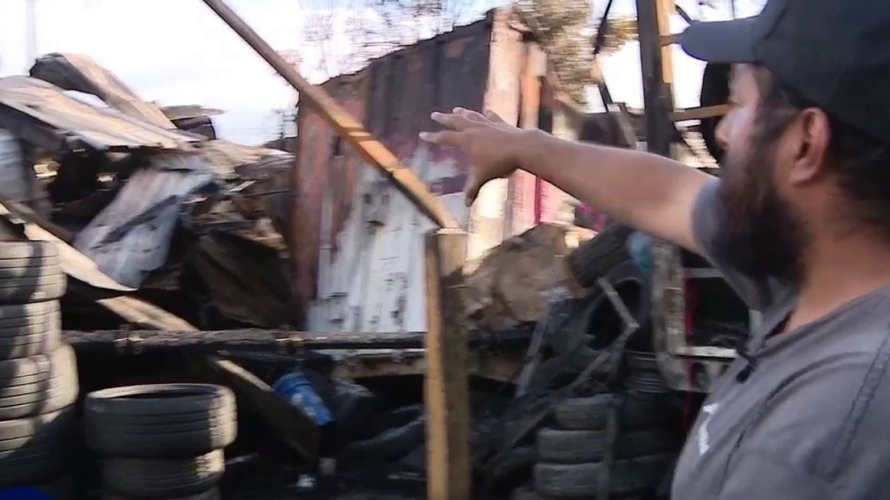 Homeless encampment fire destroys nearby shop