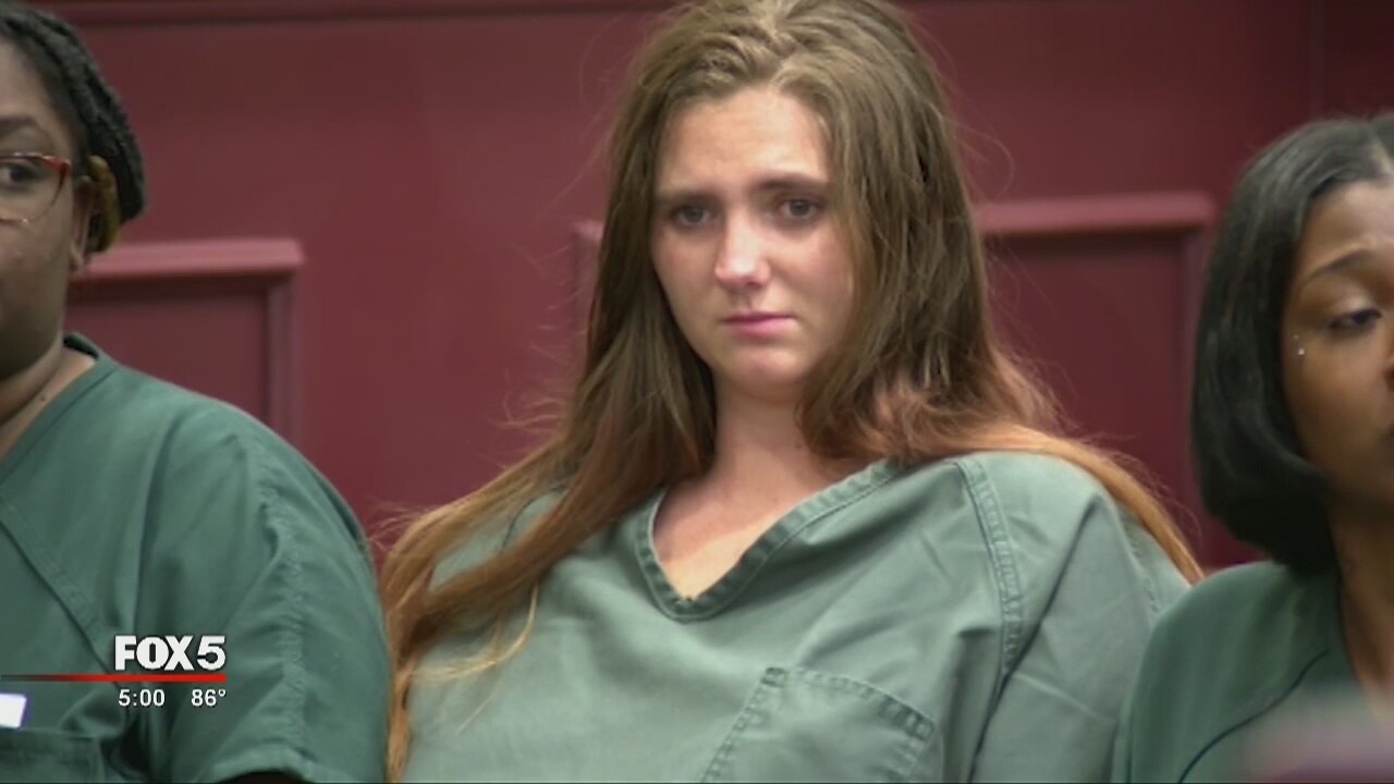 Woman charged with murder after crash makes first court appearance