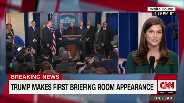 Trump makes surprise appearance in briefing room, takes no questions