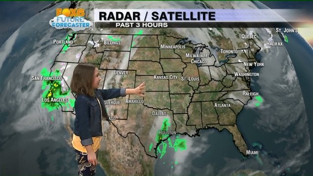 Madison helps Meteorologist Rob Haswell with the weather