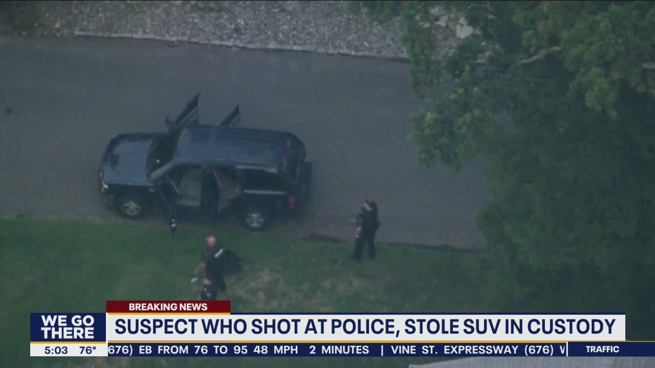 Suspect who shot at police, stole SUV in custody