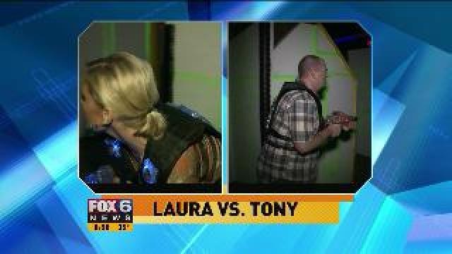 Laura takes on Tony Clark in a game of laser tag