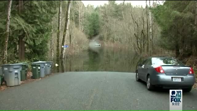 Homeowners want flooded road fixed
