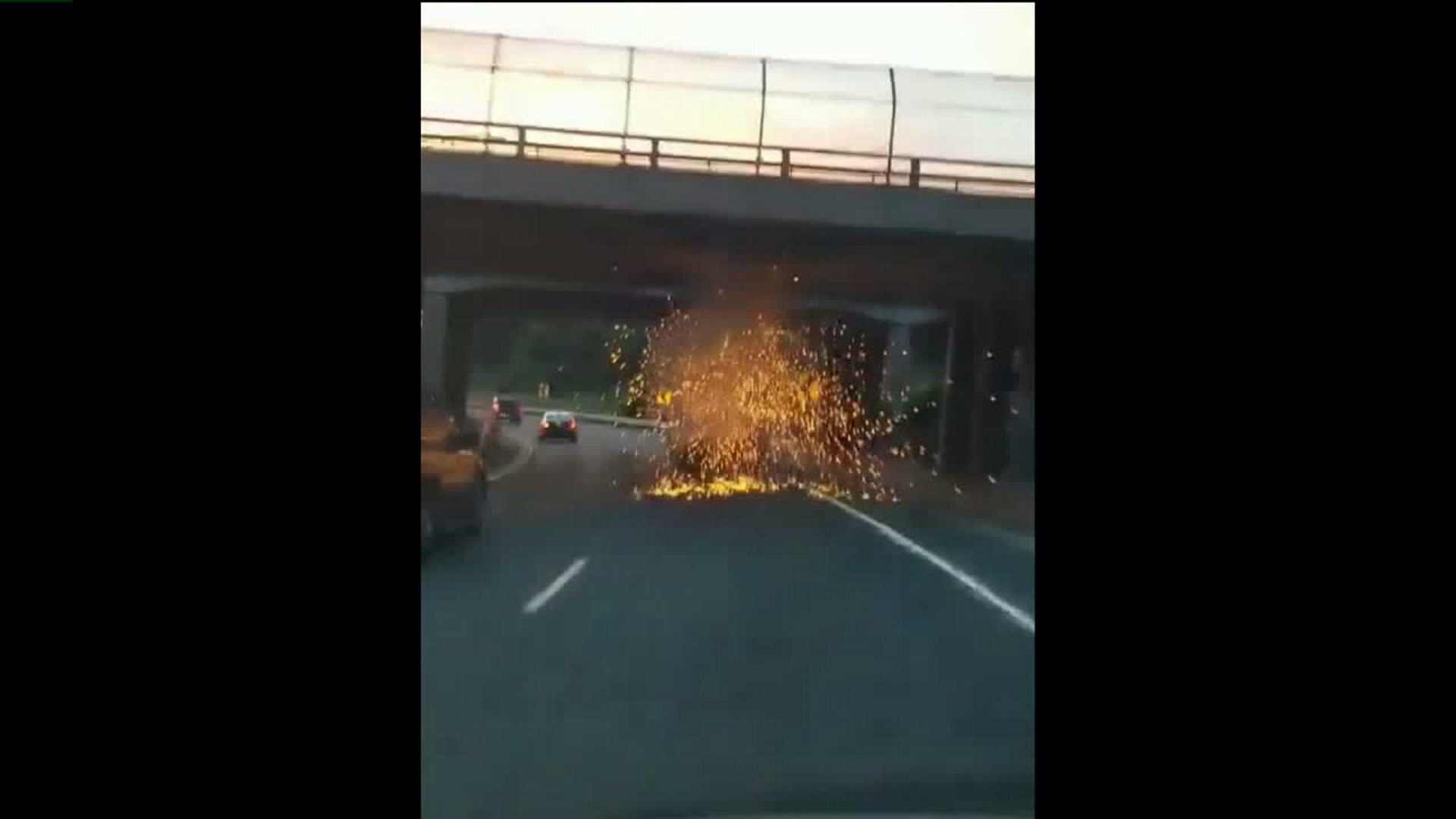 Construction equipment on trailer hits overpass (Credit: Chad Robert Crull)