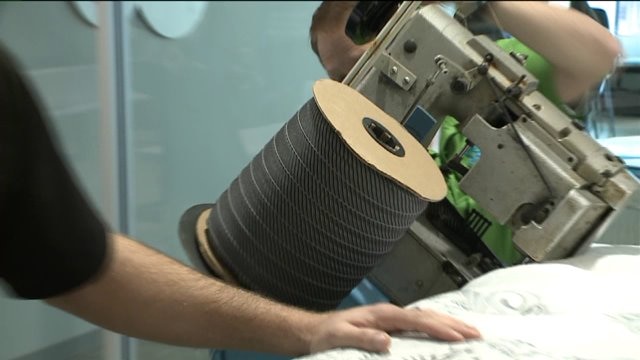 Chip helps put finishing touches on mattress