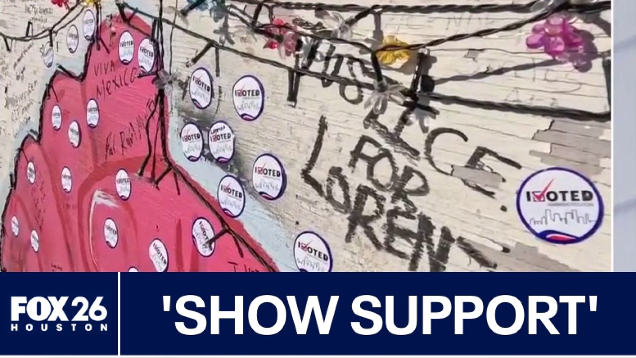 Houston voters leave stickers on memorial for man killed by ICE