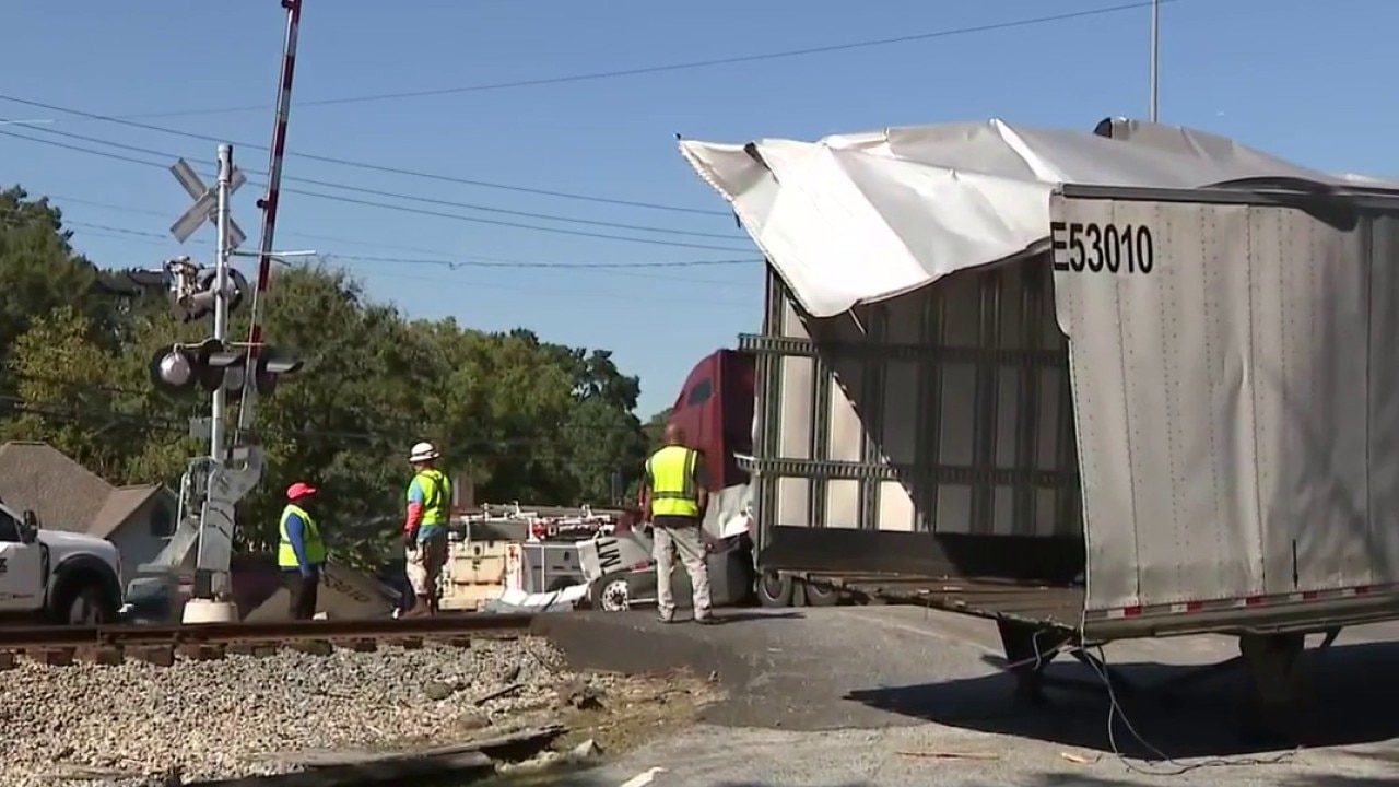 Train collides with semi-truck on tracks in Union City