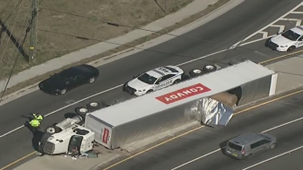 Tractor-trailer lands on its side in Gwinnett County