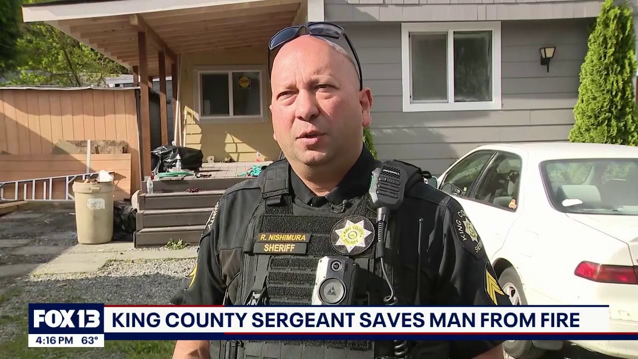 Hero deputy pulls family from burning home
