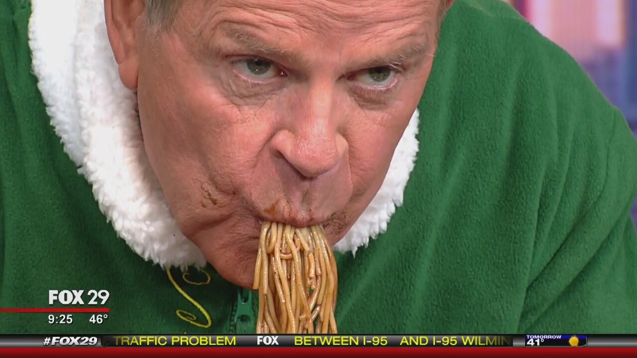 Mike Jerrick digs in to Buddy The Elf's favorite meal!