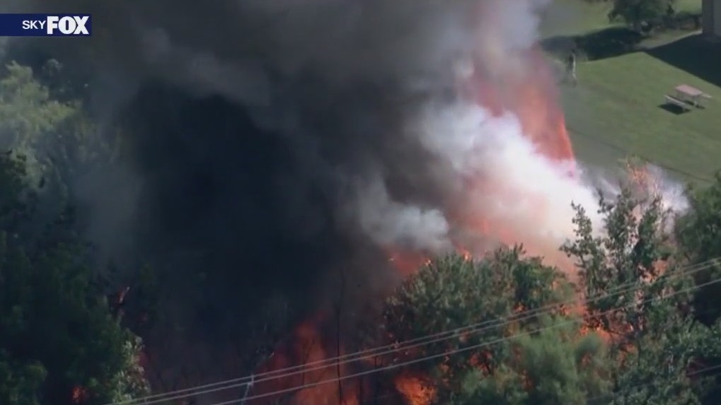 Structures, trees on fire in east Phoenix