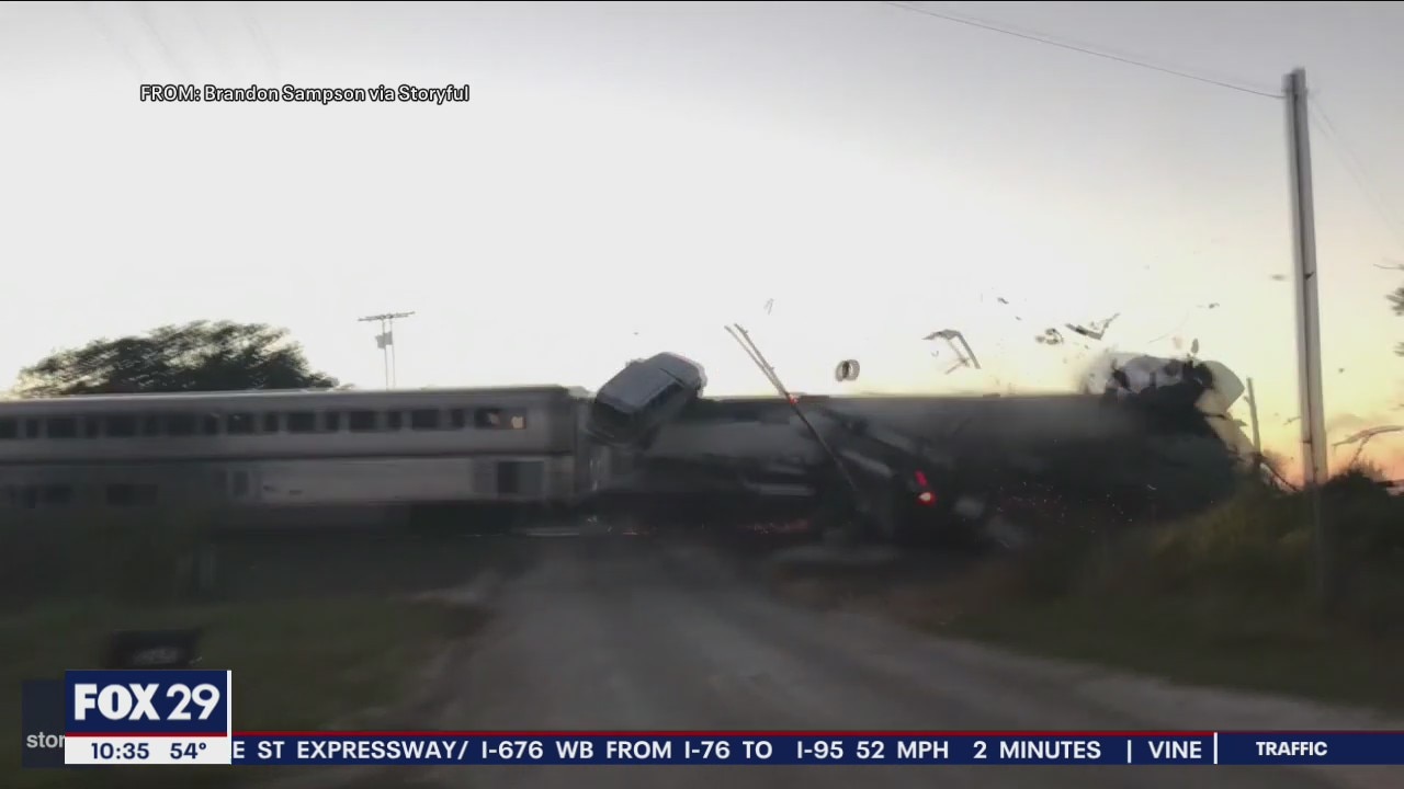 VIDEO: Amtrak train smashes into semi-truck hauling cars