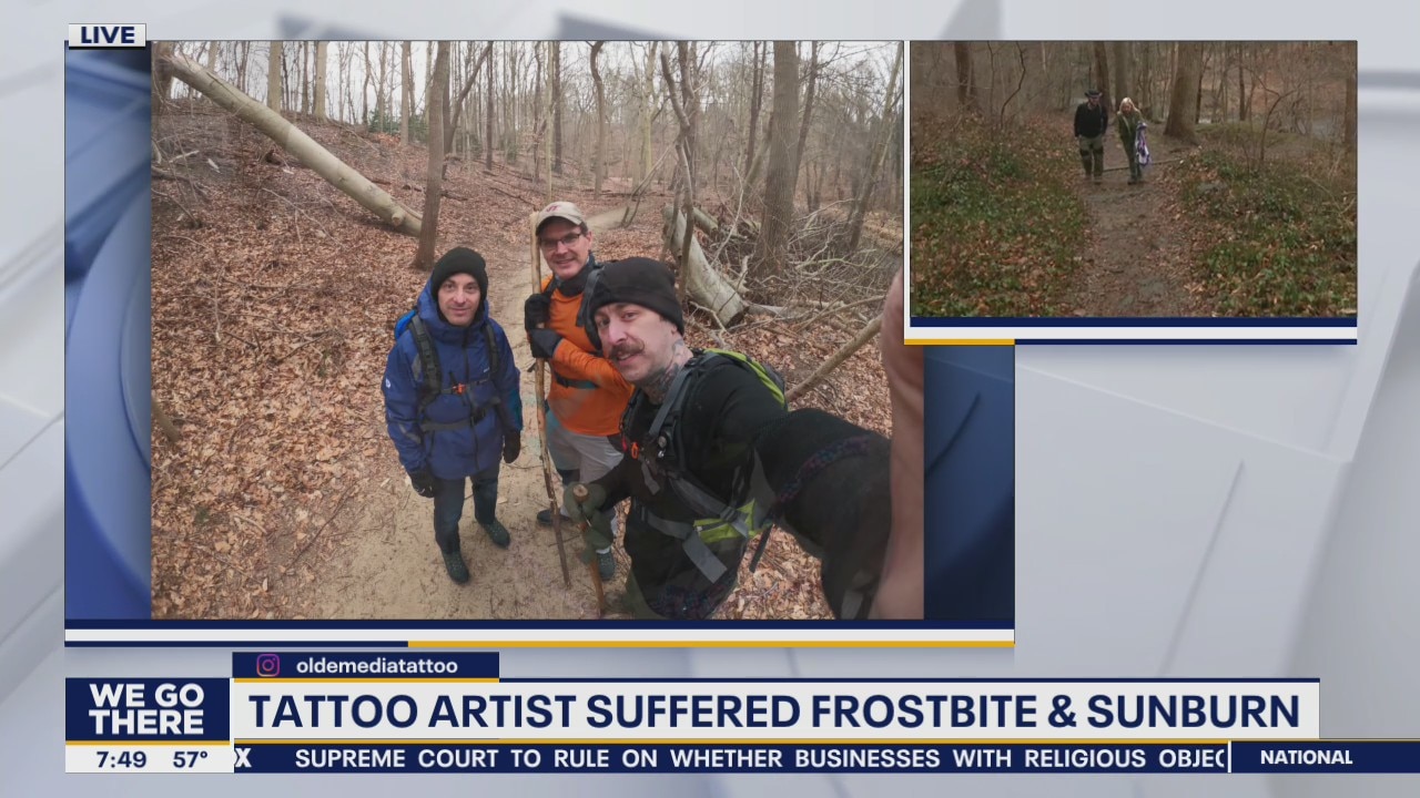 Tattoo artist carries DELCO sign to top of Mount Kilimanjaro