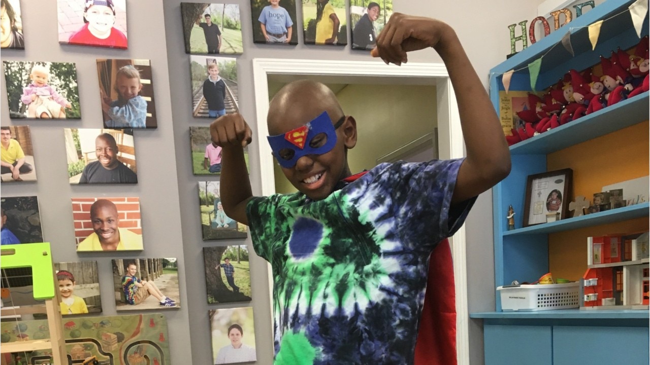 ?Stay happy, stay strong?: Inspirational 11-year-old rings cancer-free bell in time for the holidays