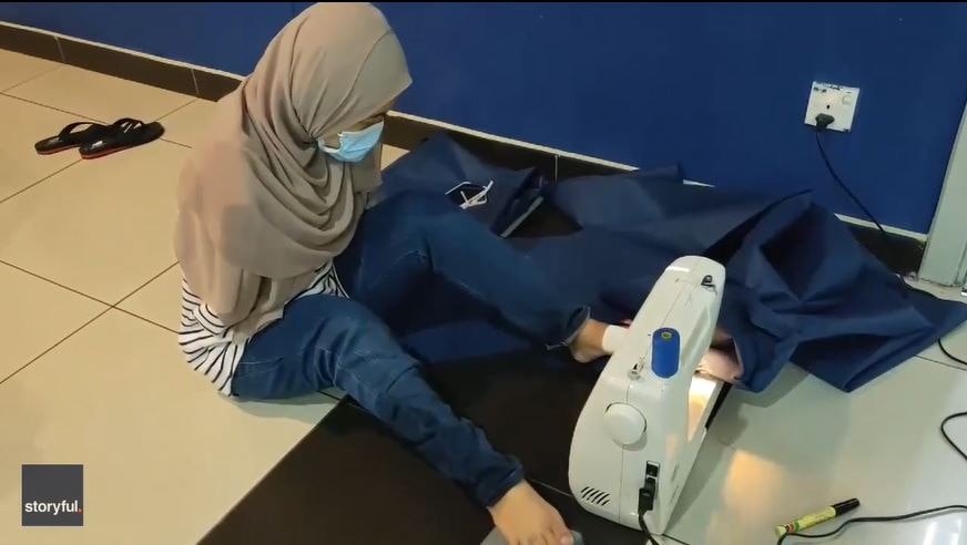 Armless woman sews PPE with feet