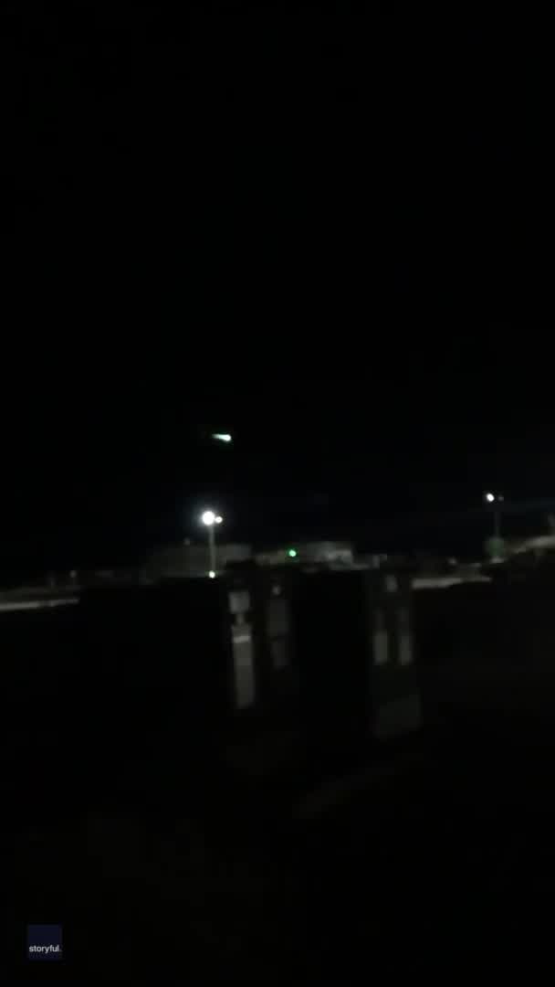 Green fireball seen across night sky
