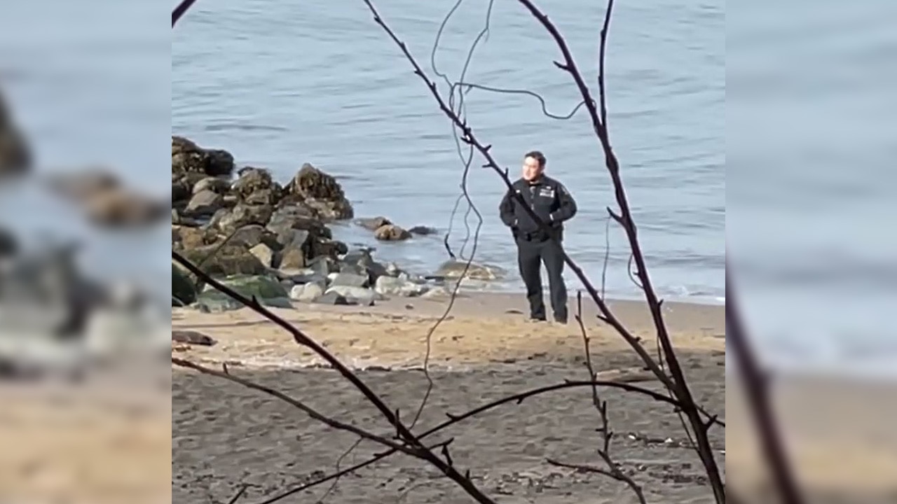 Vancouver police officers seen posing with dead body