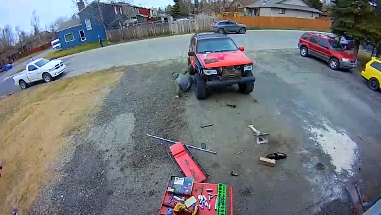 Man working under Jeep gets leg run over after vehicle suddenly starts rolling