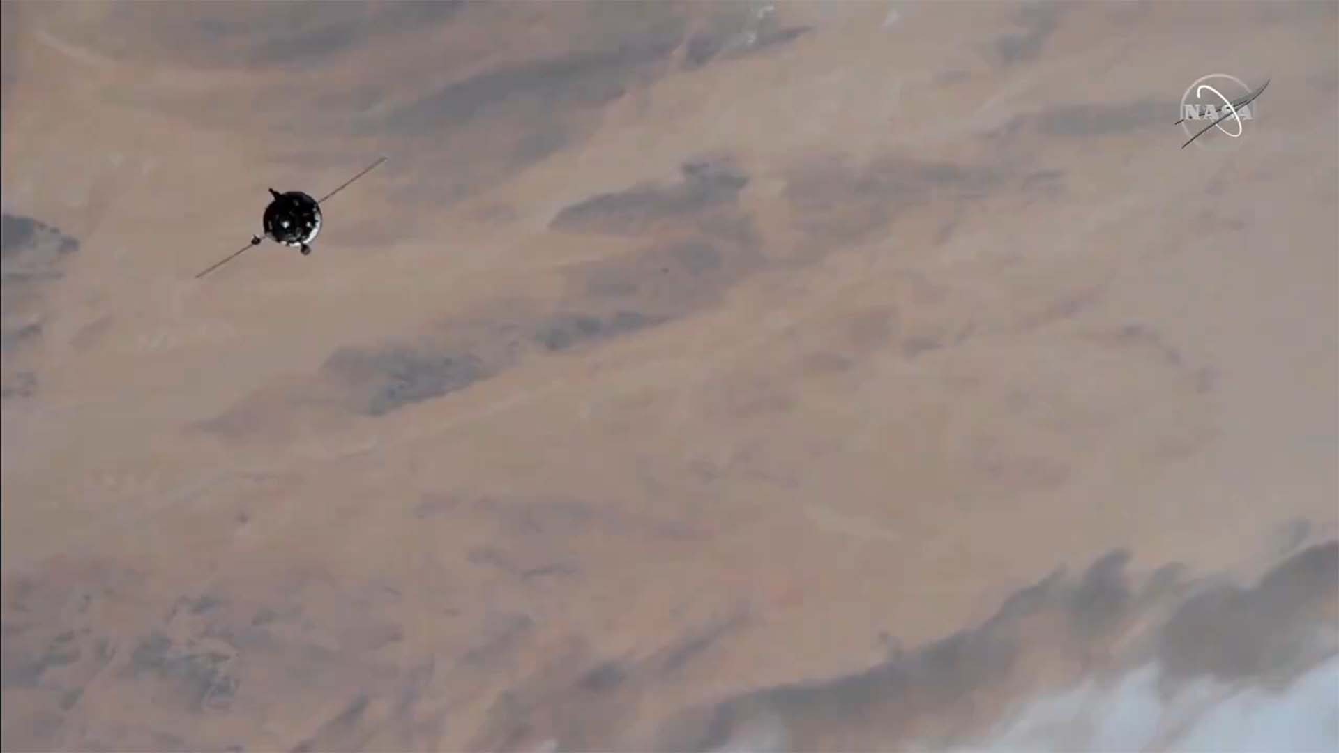 Russian craft carrying film crew prepares to dock at ISS