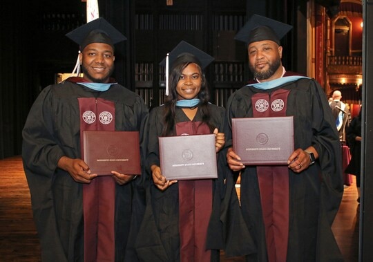 Father and children graduate together with master's degrees