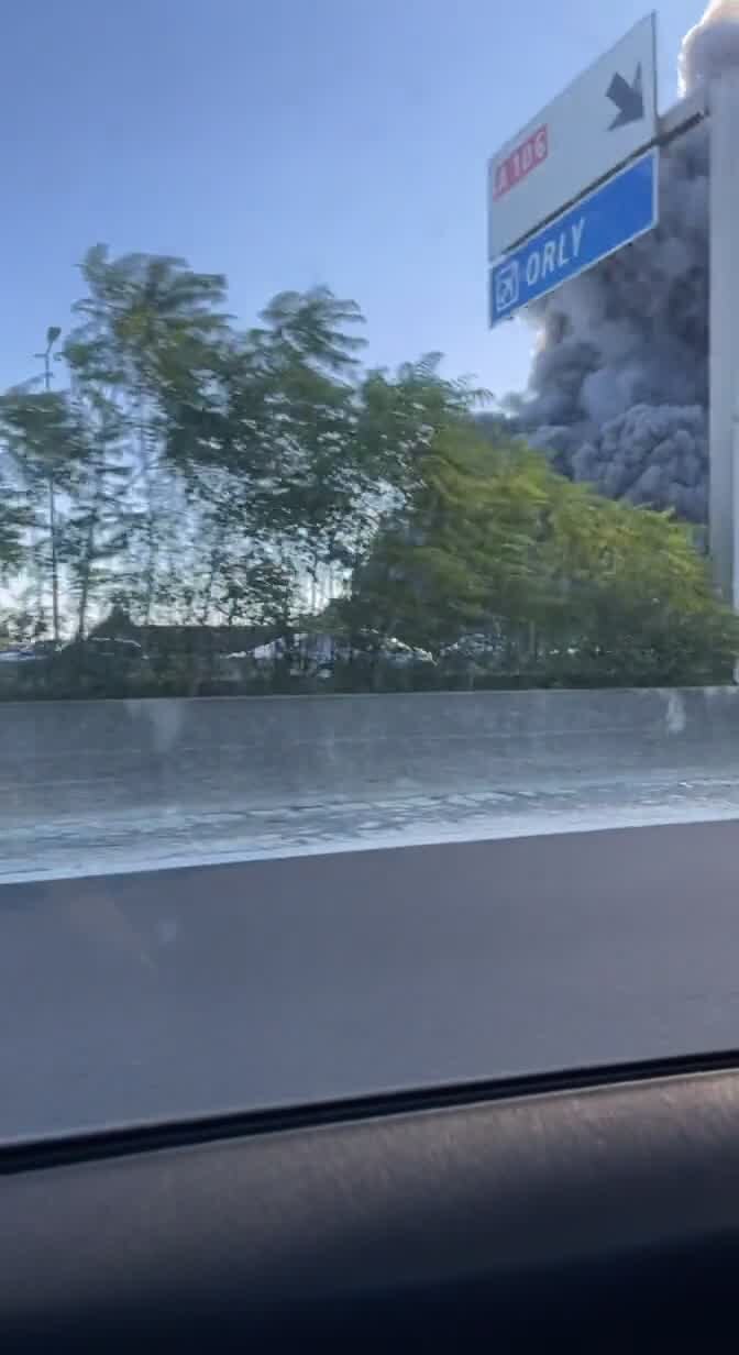 Black smoke billows from Paris warehouse fire