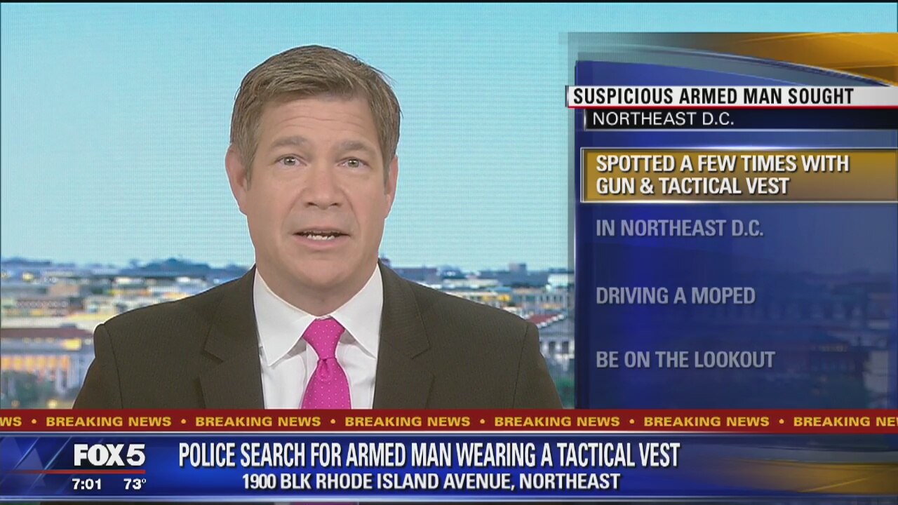 Man in tactical vest armed with gun seen near gas station in Northeast ...