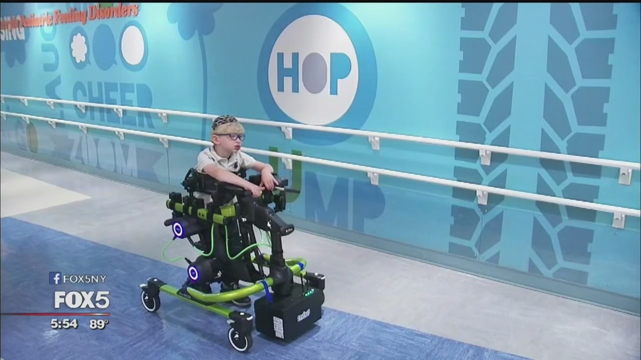 Robotic device allows young boy to take amazing strides forward