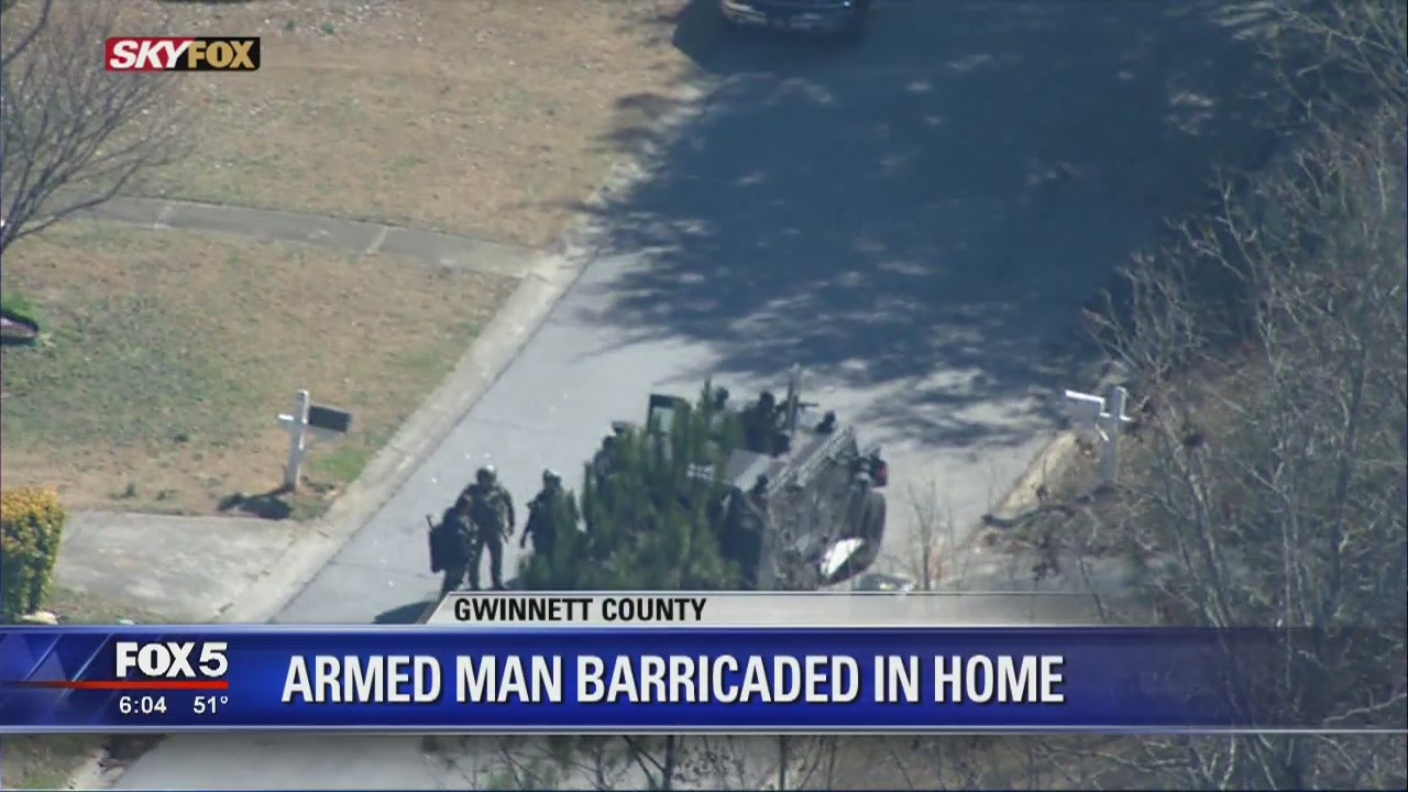 Gwinnett County armed man barricaded in home