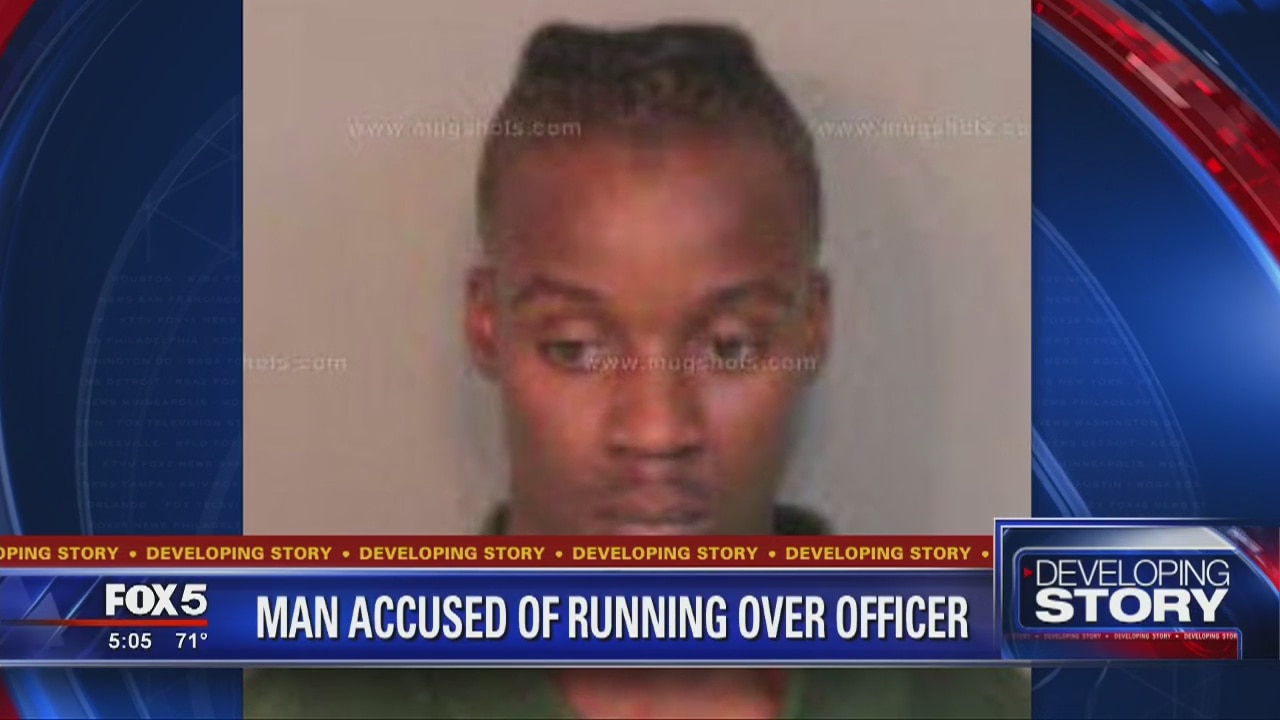 Man accused of running over officer