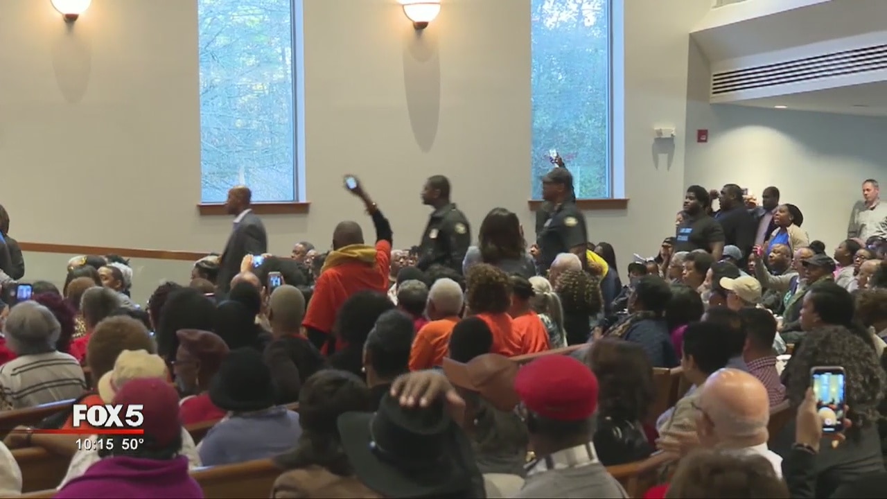 Protests erupt at town hall meeting