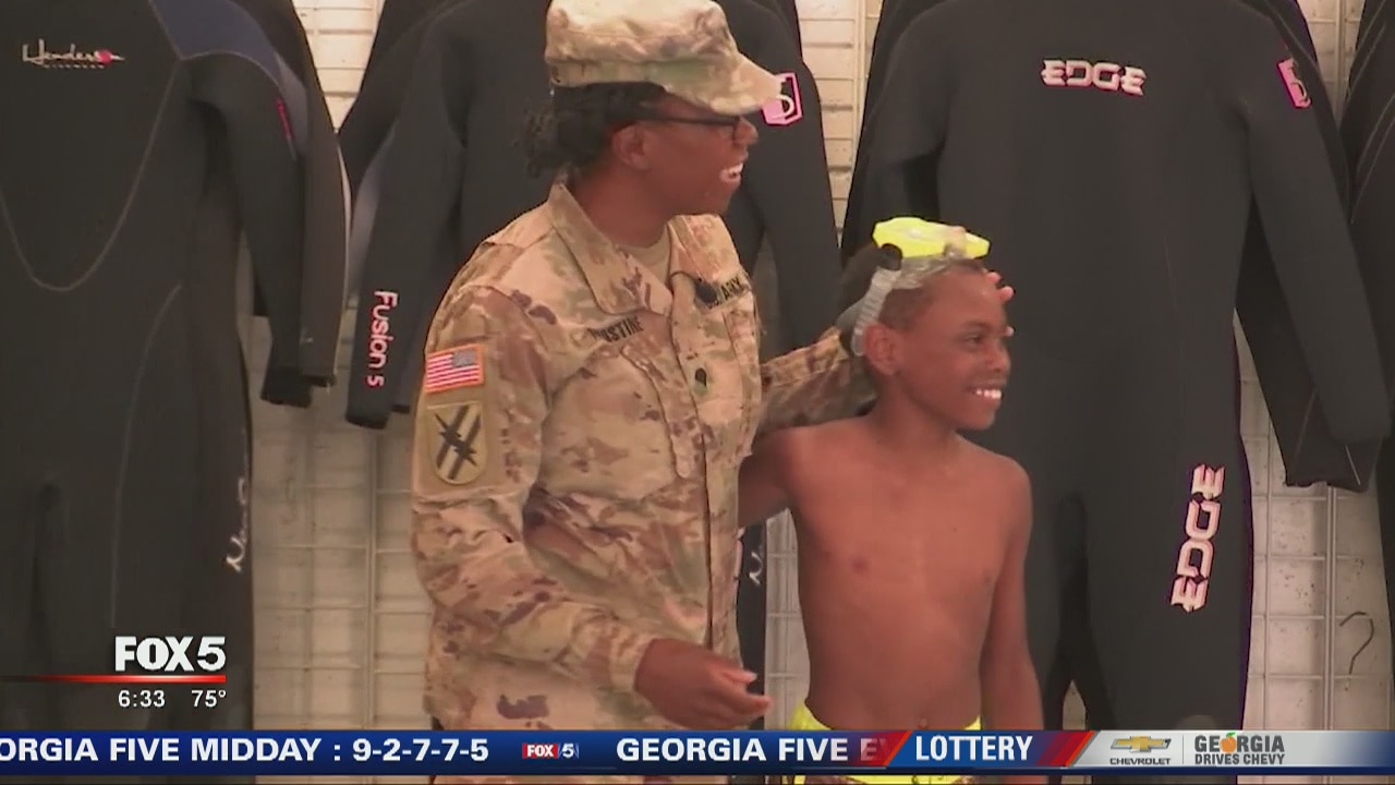 Military mom surprises son at scuba class