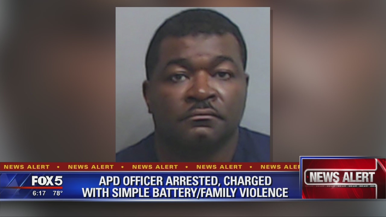 APD officer arrested