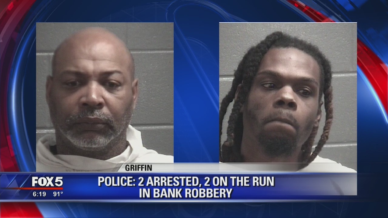 Police: 2 arrested, 2 on the run in bank robbery