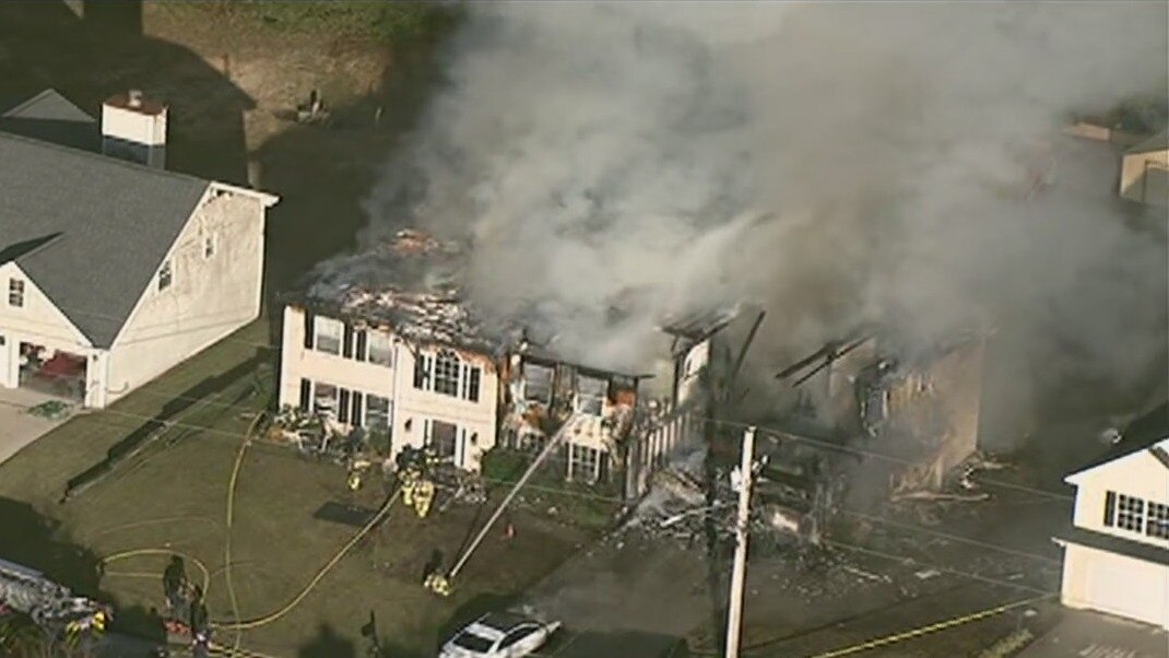 Firefighters battle Lithonia house fire