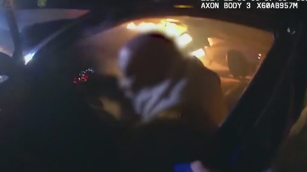 Cobb County officer saves man from burning car