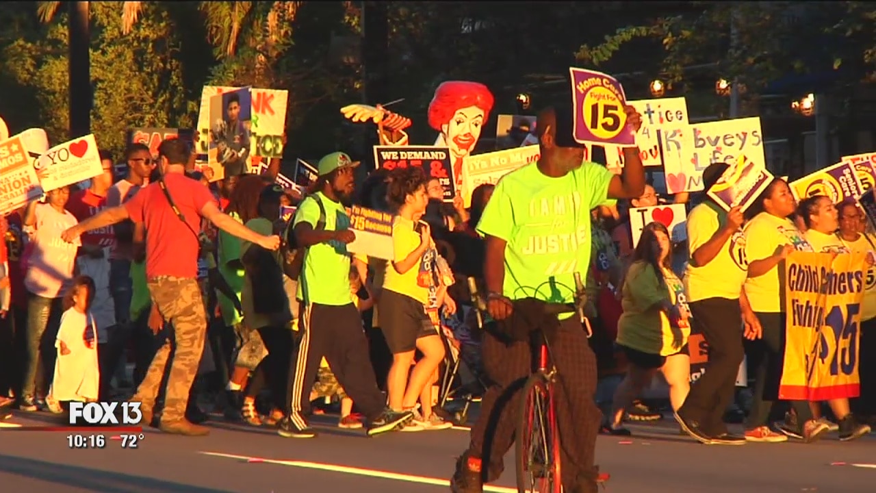 Workers rally for higher wages