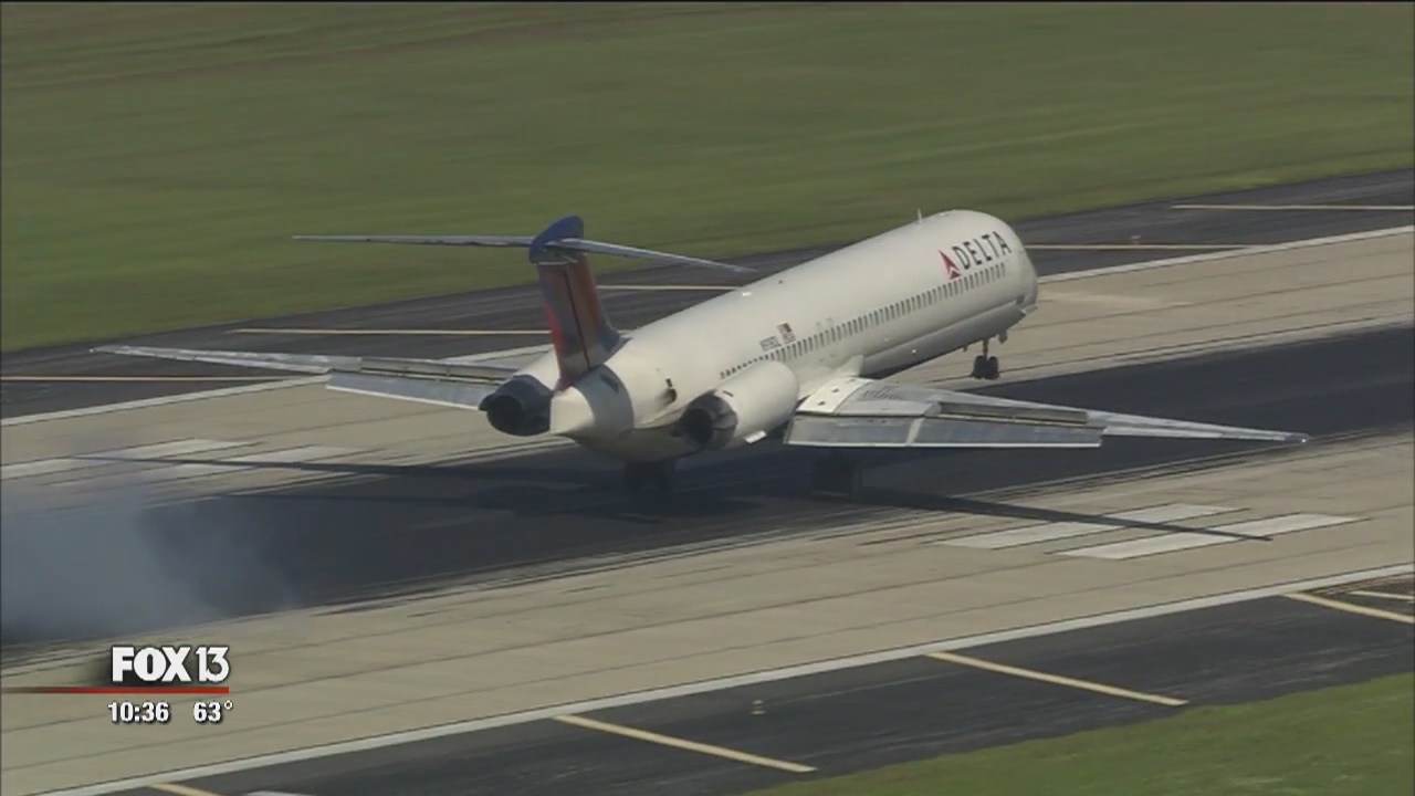 Employees blast rubber from TIA runways