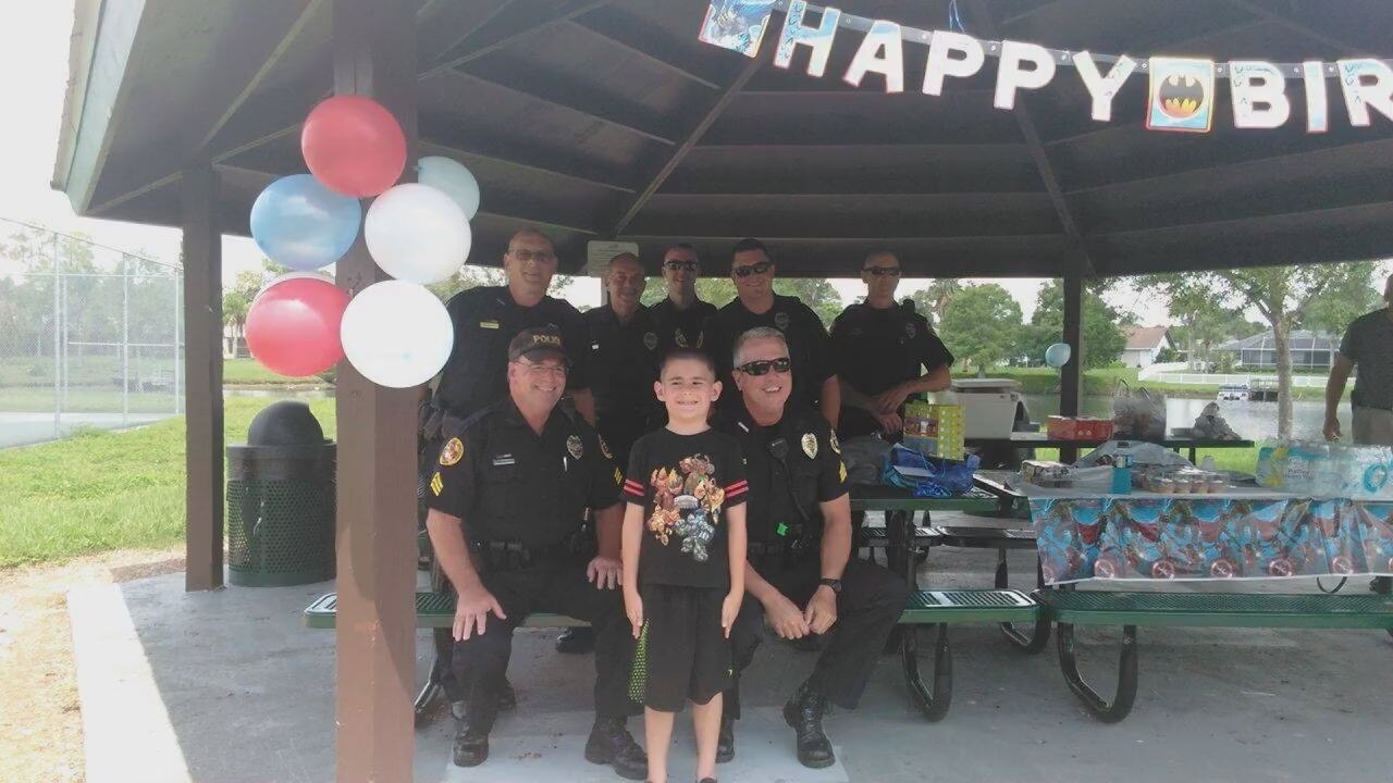 North Port officers surprise autistic boy at party