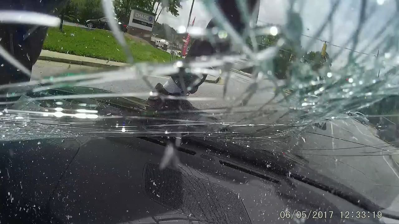 DASH CAM: Man stomps woman's windshield
