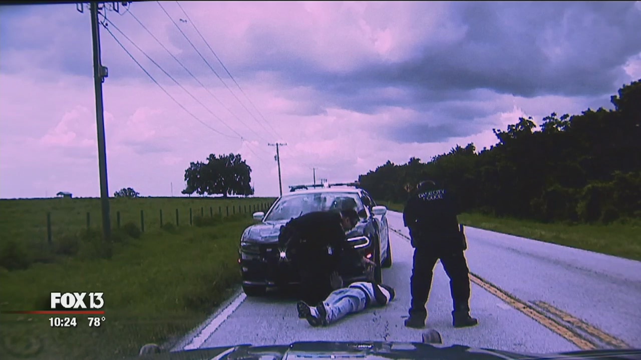Man with knife jumps on hood of police cruiser