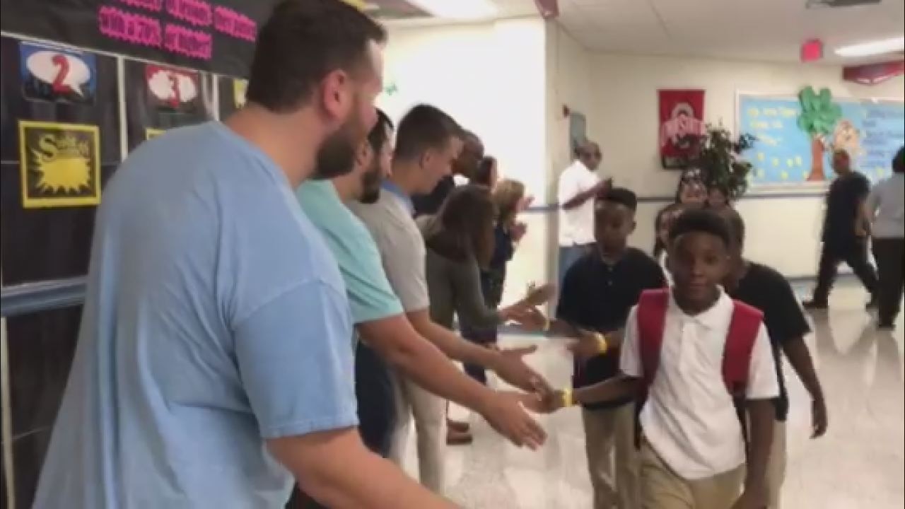 Dads greet kids for first day of school