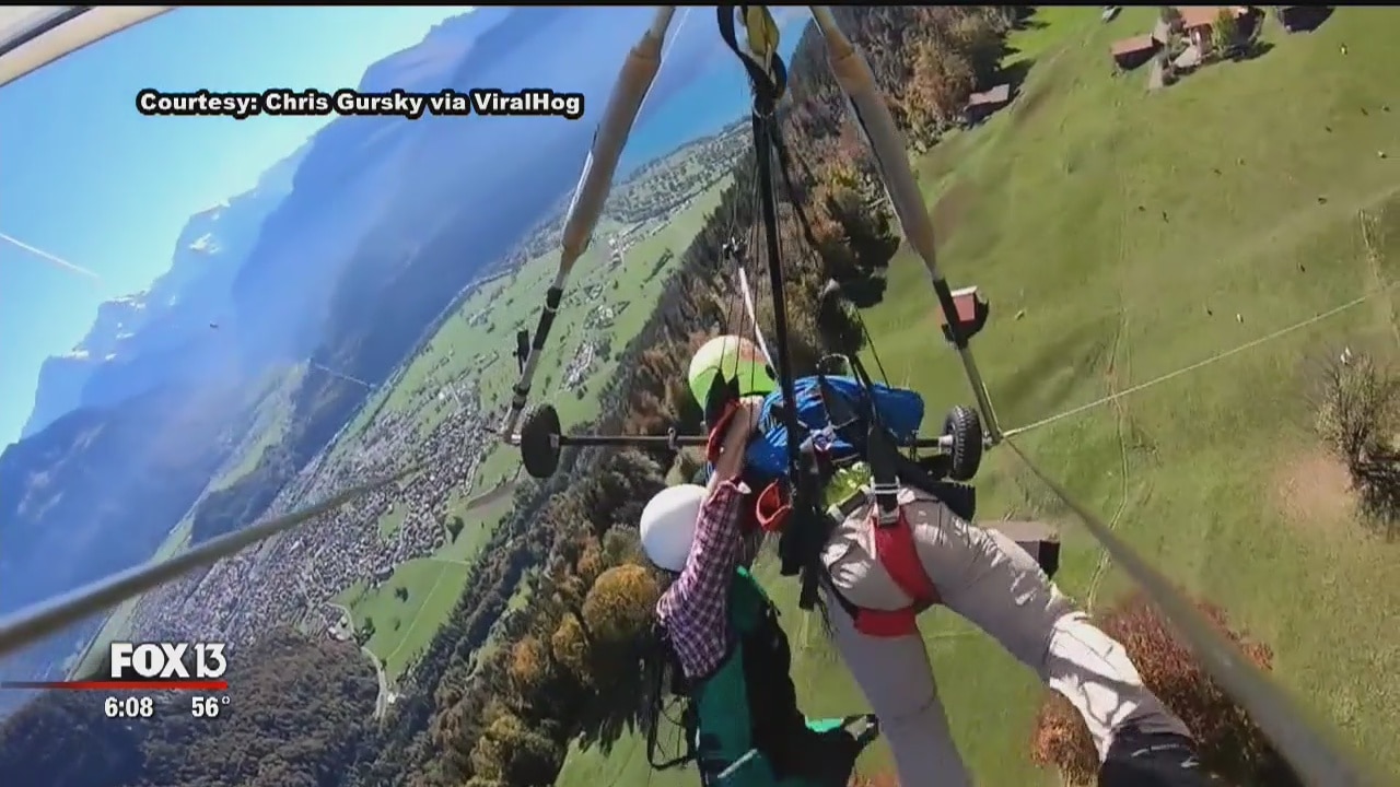 Man hangs from glider during terrifying flight