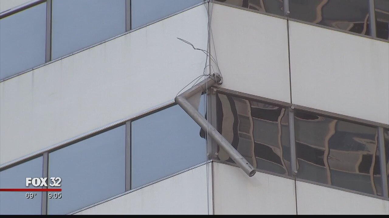 Falling scaffolding damages vehicle, breaks windows of Loop building