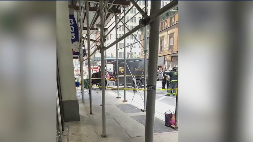 2 hospitalized after truck crashes into sidewalk shed in Manhattan