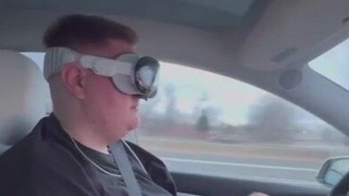 Apple Vision Pro user wears headset while driving