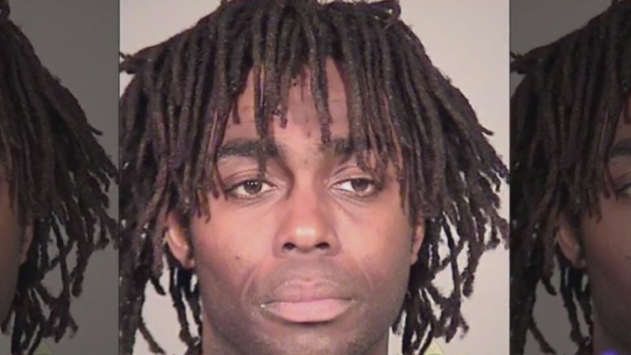 Crazy Azz Criminals: Man holds up donut shot with hatchet