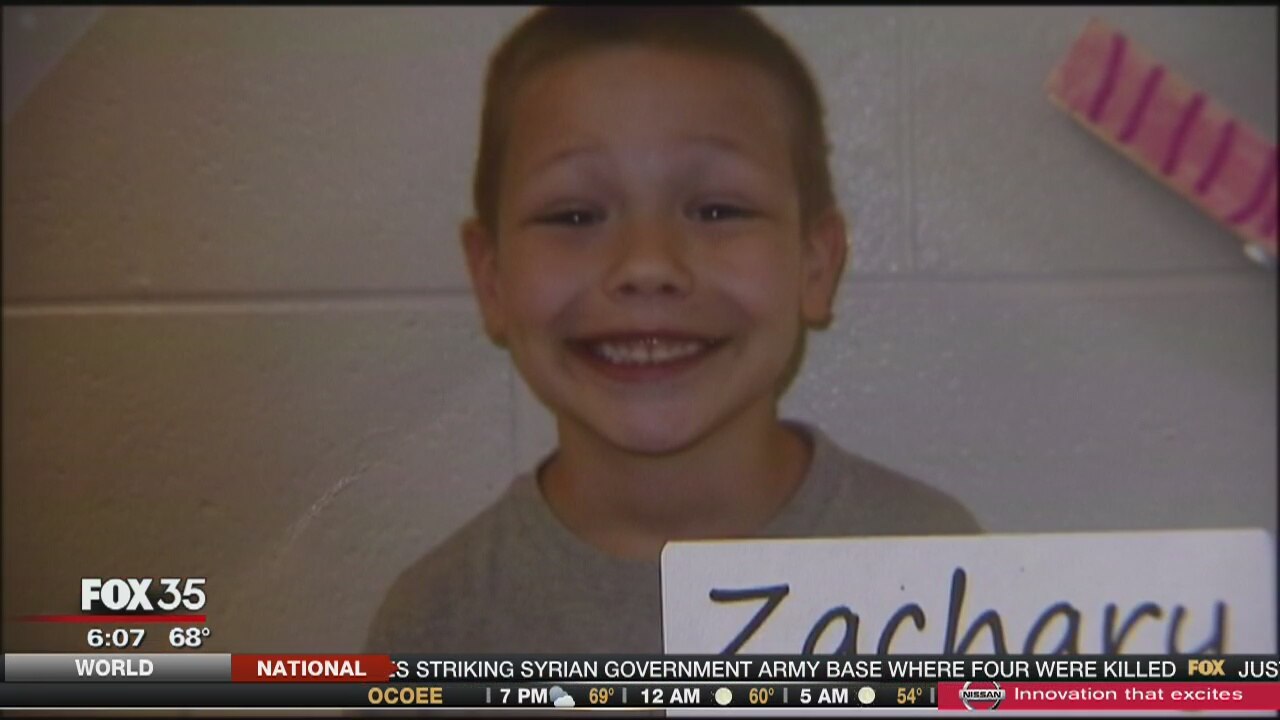 School kids collect loose change to help classmate