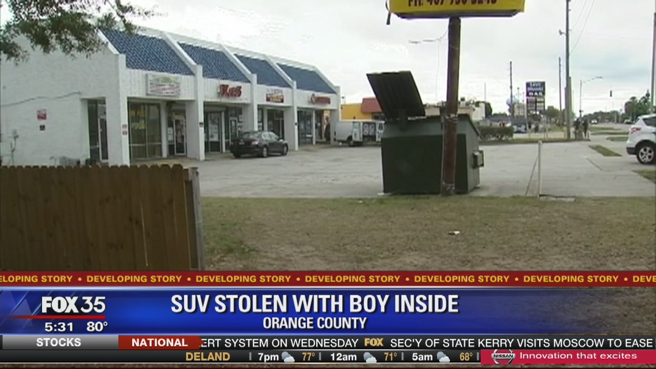 SUV stolen with boy inside